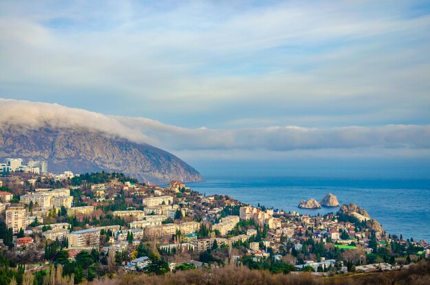 A small town by the sea on the background of a mountain.