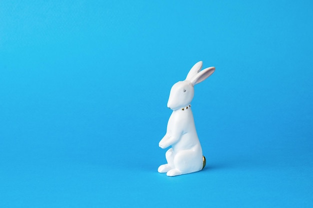 A small toy bunny on a blue background