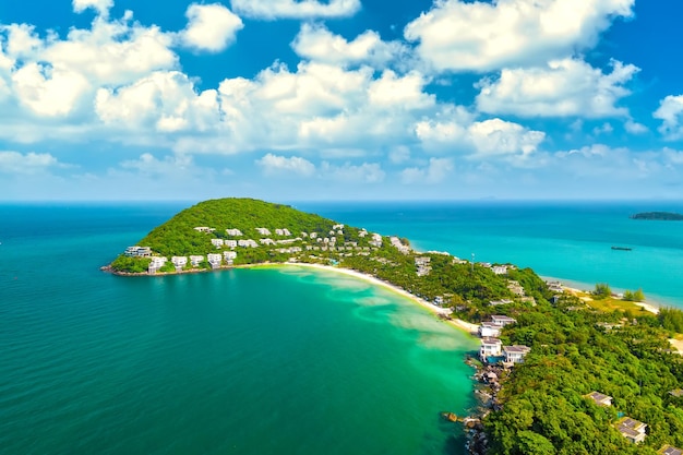 Small tropical island in the ocean with many resorts, aerial view of Ong Doi island in Phu Quoc