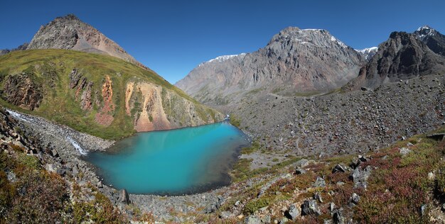 Small turquoise lake in the Altai mountains, scenic panoramic view