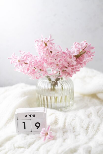 A small vase with a date of april 19 on it