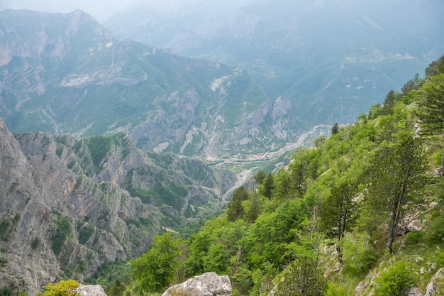 A small village is at the bottom of a deep canyon