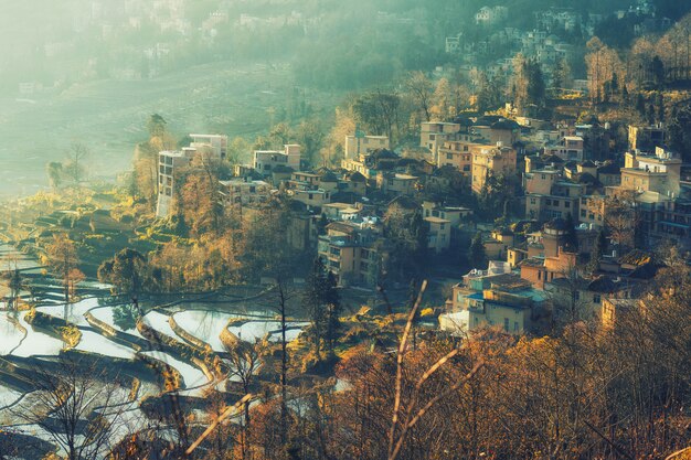 Small village and Terraced rice fields of YuanYang , China in the morning