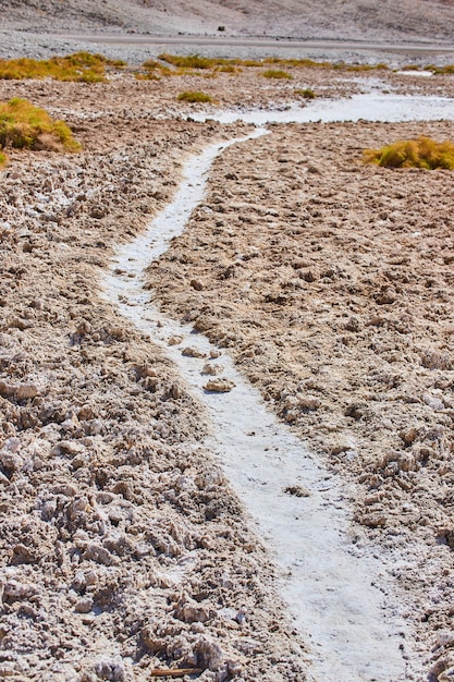 Small walking path through salt formations in death valley