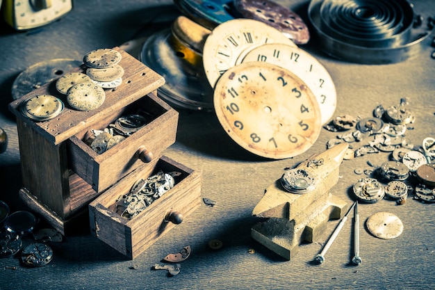 Small watchmaker's workshop with damaged clocks