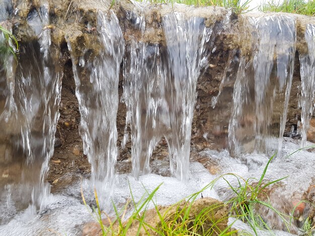 A small waterfall Flowing water erodes the soil