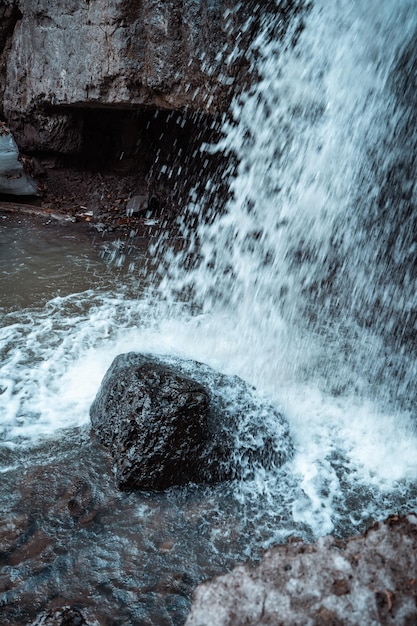 Small waterfall in a rocky area in spring Environment Wild nature