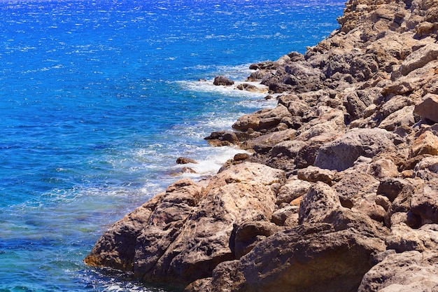 Small waves beating against shore