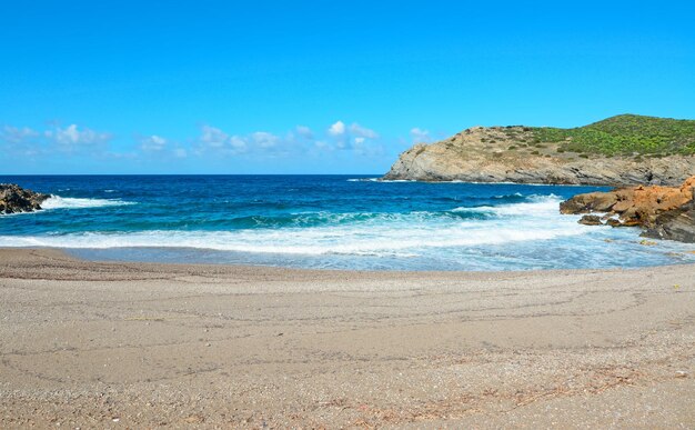 Small waves on a clear day in Argentiera Sardinia