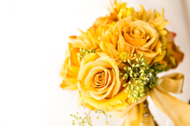 Small wedding bouquet with roses on a white background.