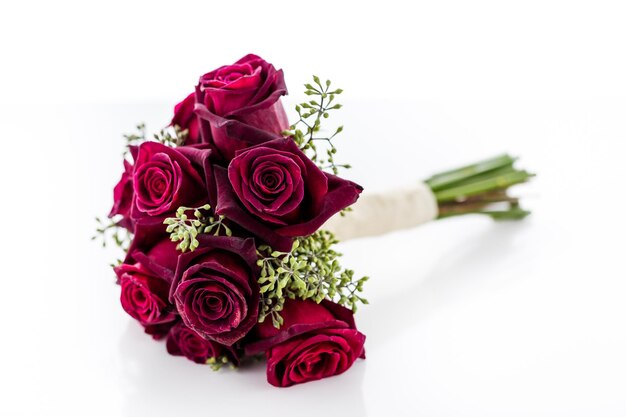 Small wedding bouquet with roses on a white background.