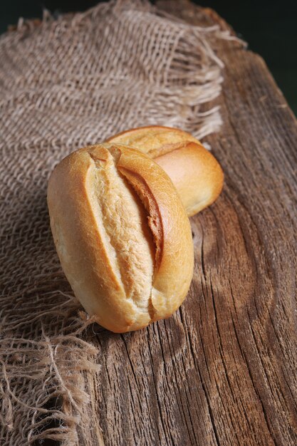 small white bread on wooden board