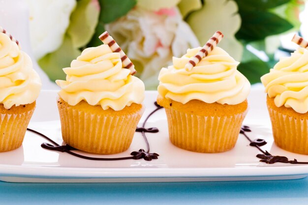 Small white chocolate cupcakes at desesrt bar.