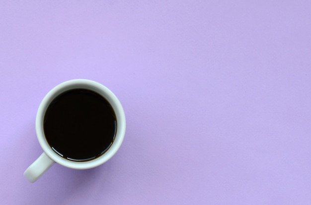 Small white coffee cup on texture background of fashion pastel 