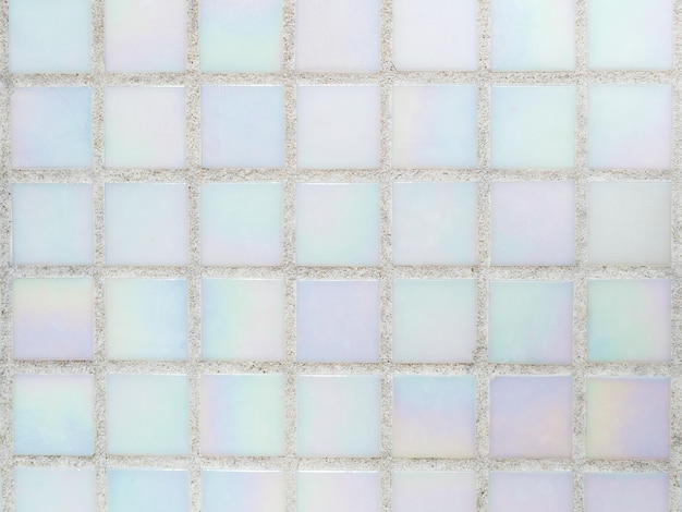 Small white motherofpearl tiles in the pool