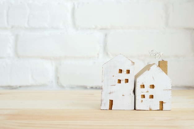 Small wood house on table background