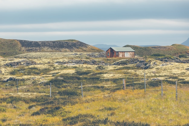 Small wooden cottage in Iceland landscape