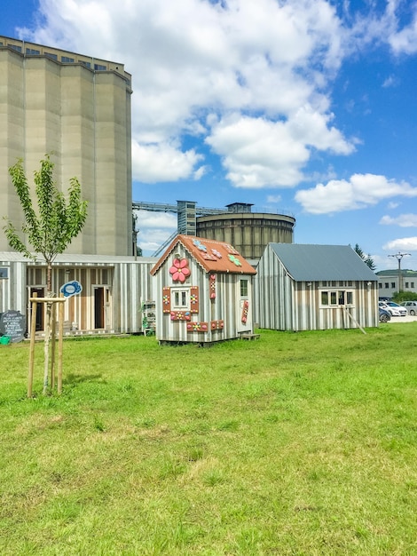 Small wooden house for children playground surrounded by trees