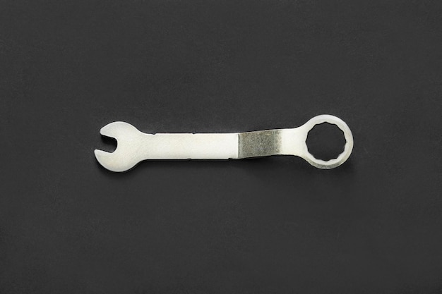 Small wrench on black