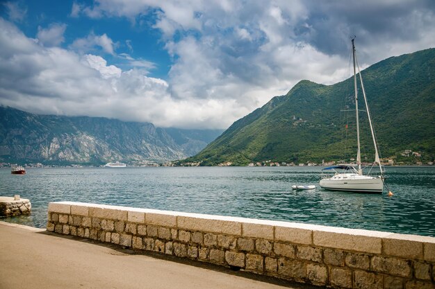 A small yacht sailing in the Bay of Kotor Montenegro