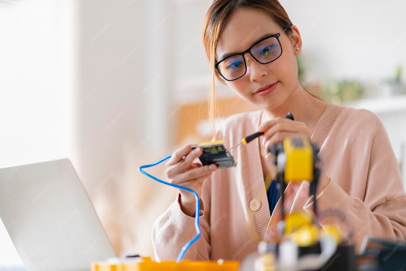 Premium Photo | Smart asian female programer learning robot arm ai ...