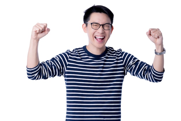 Smart attractive asian glasses male hand rise up cheerful exited standing and smile with freshness and joyful casual blue shirt portrait white background
