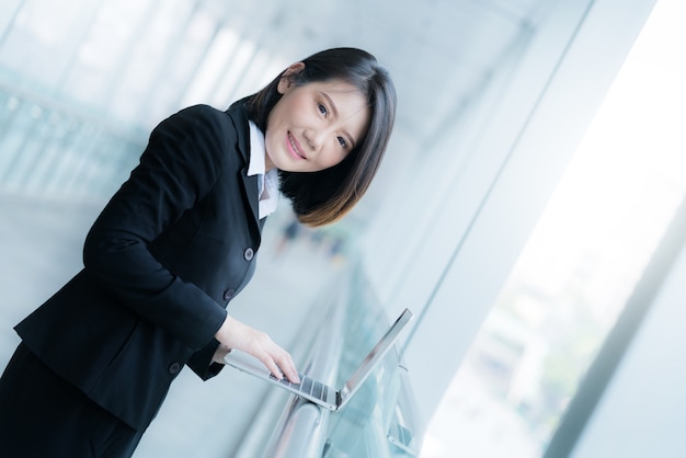 smart beautiful asian woman with laptop