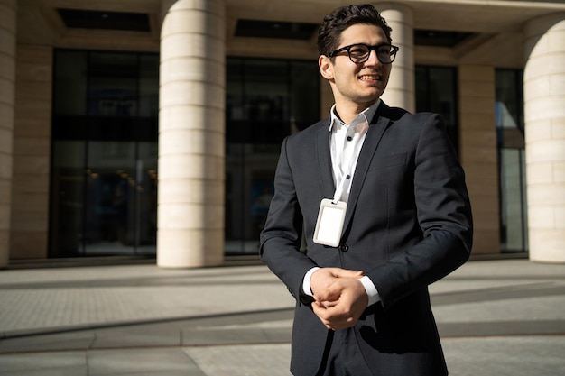 A smart bespectacled man in a formal suit A confident person goes to work in the office