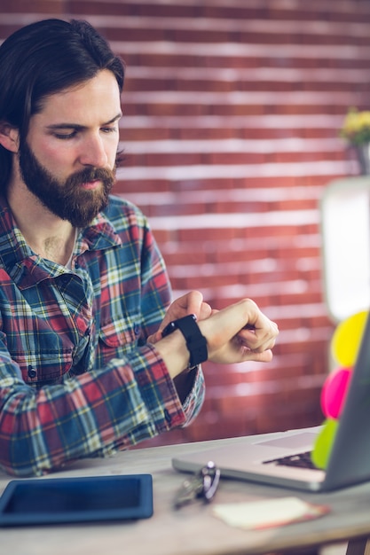 Smart businessman checking time 