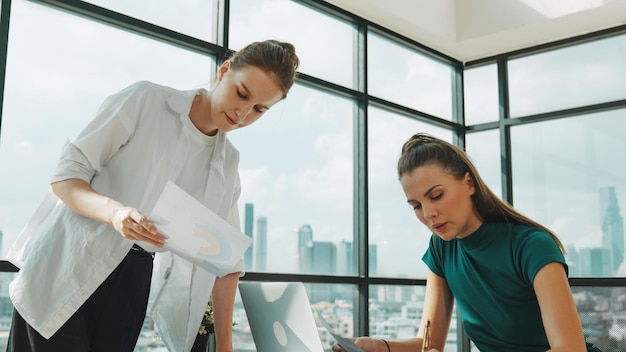 Smart businesswoman present project while manager listen carefully Tracery