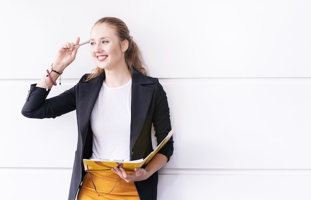 Smart businesswoman working with document in her workstation at office.