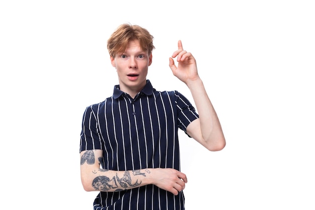 Smart handsome young blond man in a tank top on a white background