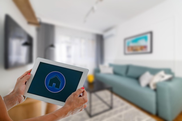 Smart Home App on a Tablet Woman Controlling Appliances at Home