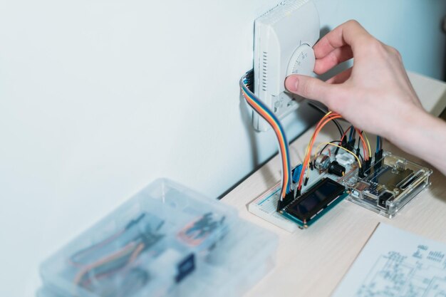 Smart home custom made system installing modern house appliances managing device hand checking temperature control