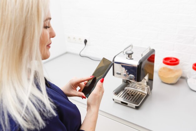 Smart Home Device-Home Management. Woman presses the virtual button