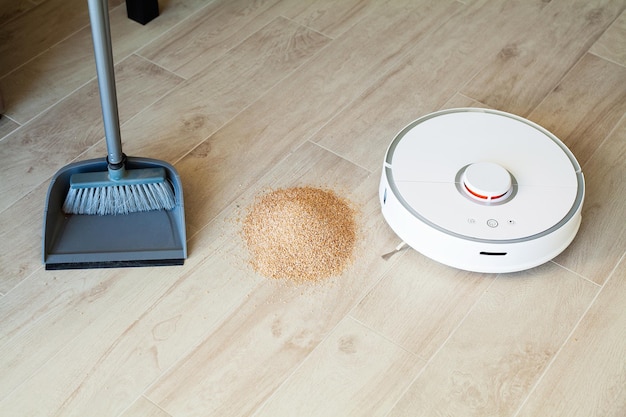 Smart House Vacuum cleaner robot runs on wood floor in a living room