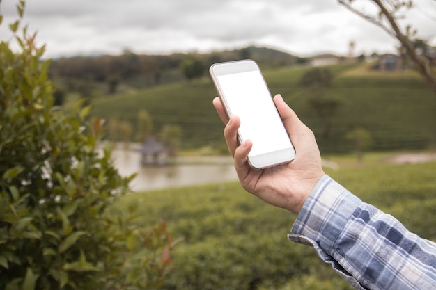 Smart phone mock up white screen on hand