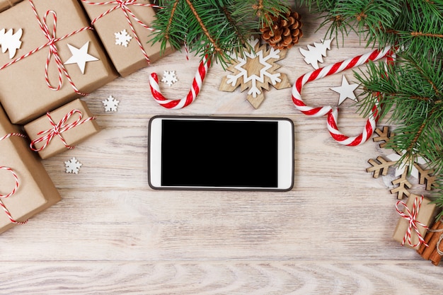 Smart phone mock up with rustic christmas decorations for app presentation