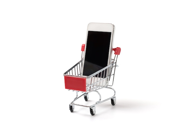 Photo smart phone in shopping cart on white background