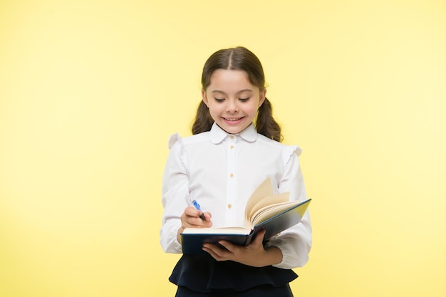 Smart school girl childrens day small girl child private teaching Education online happy little girl in school uniform Back to school Childhood happiness School curriculum