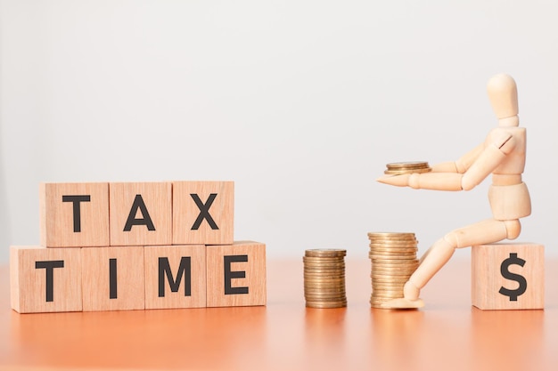 Smart strategies for tax season A wooden dummy that stacks coins at tax time