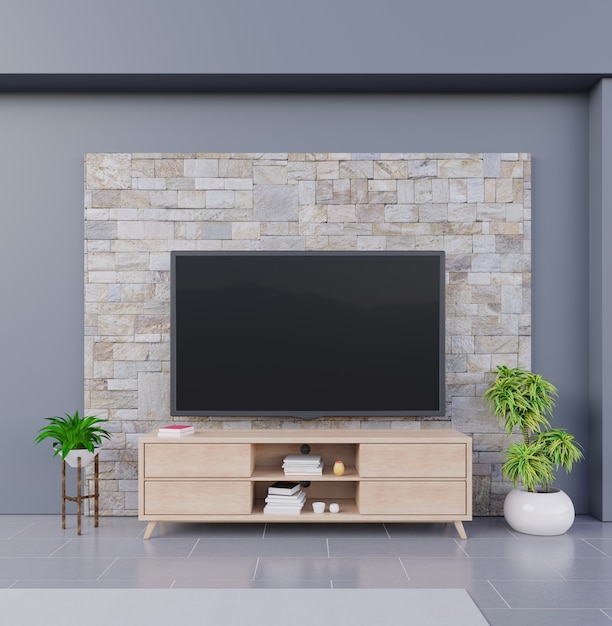 Фото Смарт-телевизор на фоне кирпичной стены, с деревянным шкафом и растениями