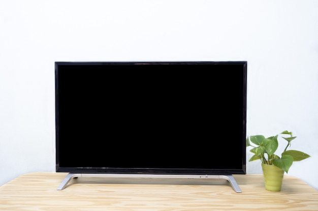 Smart tv on the wooden table