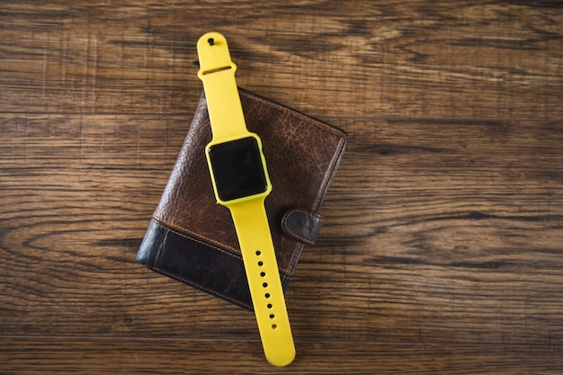 Smart watch on the wallet on the table