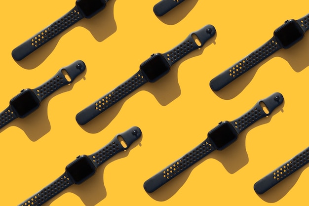 smart watch with shadows on a bright yellow background modern gadgets