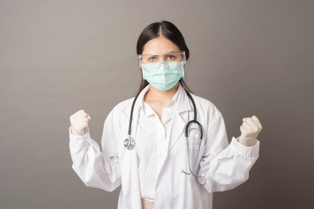 Smart woman doctor is holding stethoscope