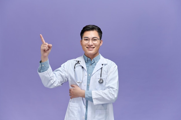 Smart young doctor pointing at something