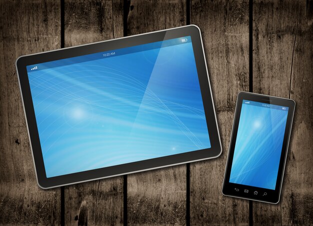 Smartphone and digital tablet PC on a dark wood table