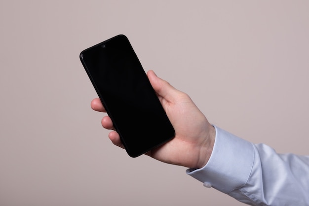 Smartphone in a hand of businessman