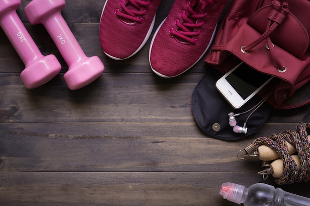 Smartphone in the handbag on wood